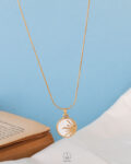 half white sun necklace