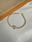 gold tennis heart bracelet