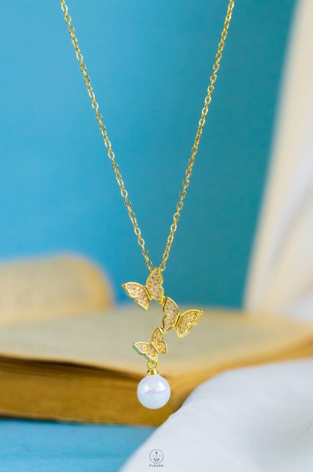 three butterfly pearl necklace