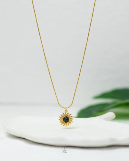 black sun gold necklace