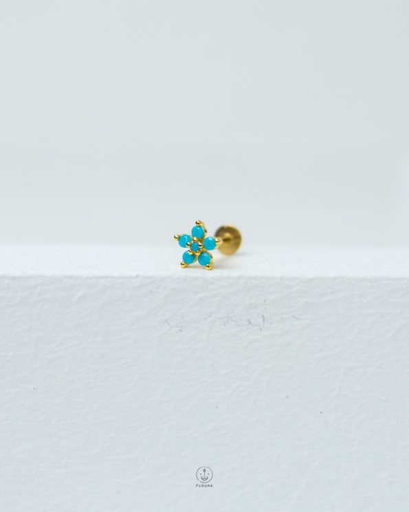 blue flower piercing