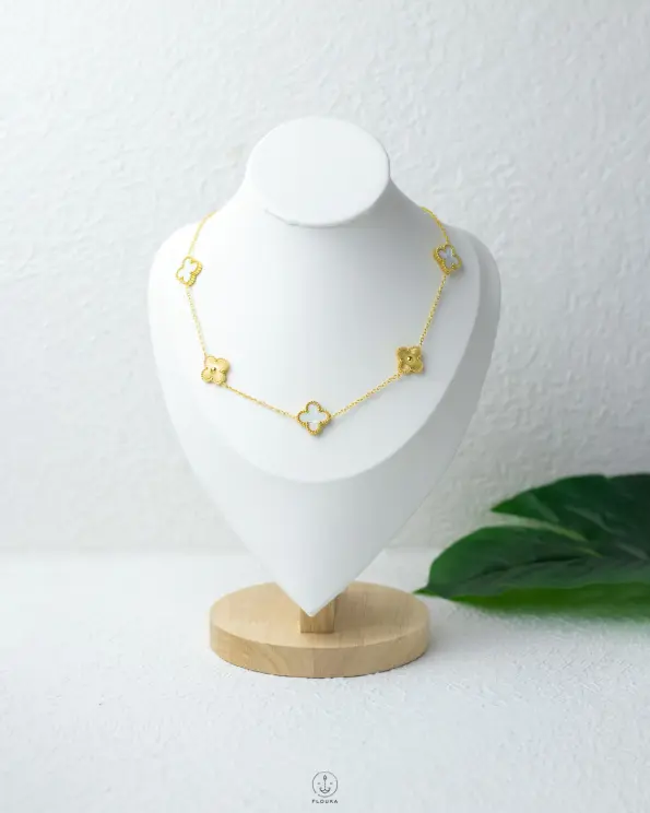 white & gold vancleef necklace