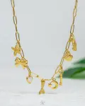 seahorse and seashell gold necklace