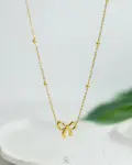 golden tie balls necklace