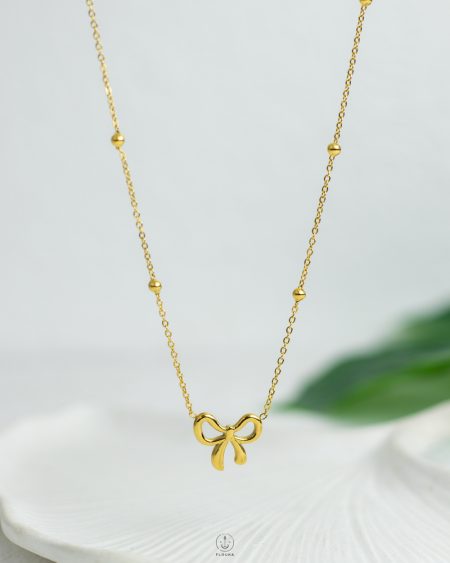 golden tie balls necklace