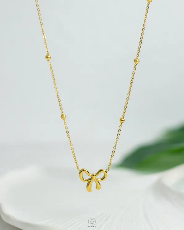 golden tie balls necklace