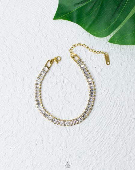 white straus gold bracelet