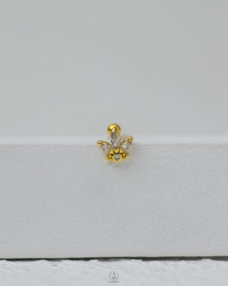 gold strus piercing