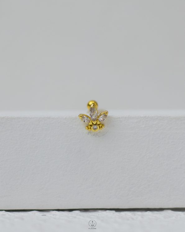 gold strus piercing