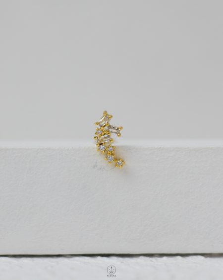 golden strus piercing