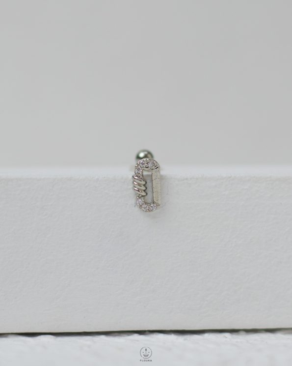 silver oval strus piercing
