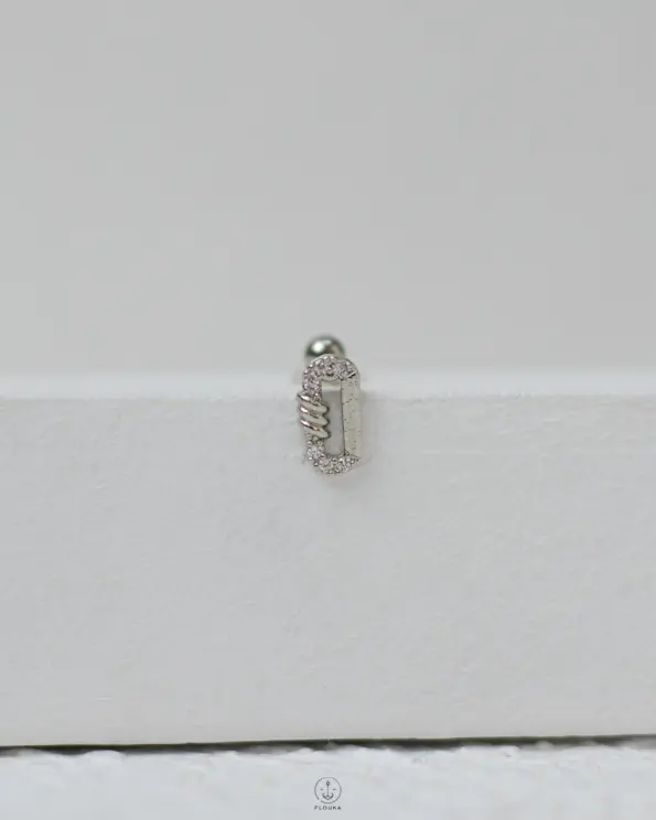 silver oval strus piercing