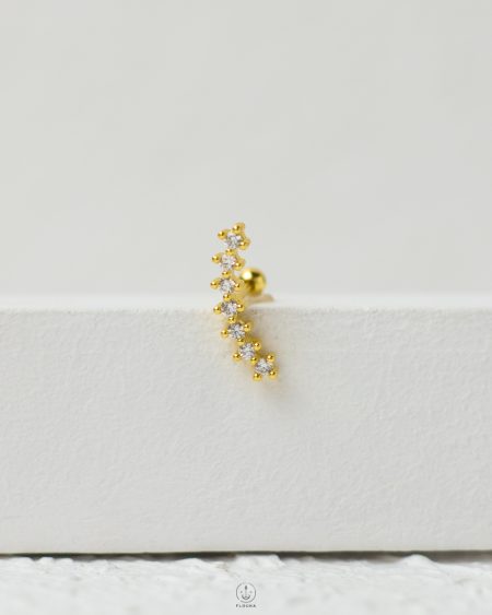 gold strus piercing