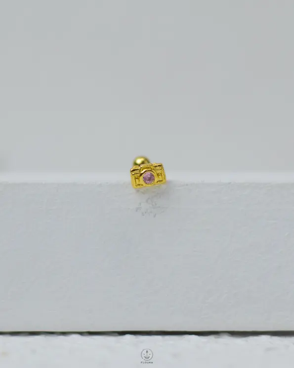 gold camera piercing
