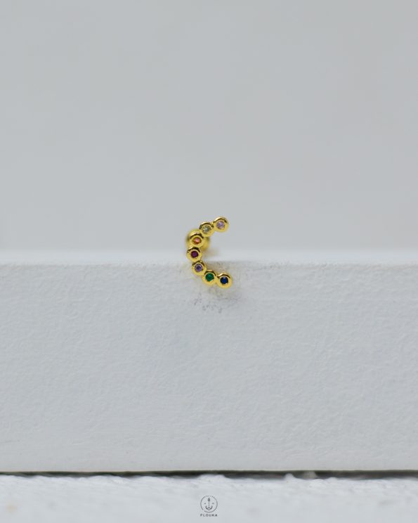 gold many color strus piercing