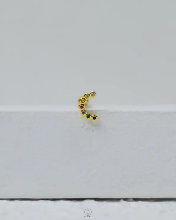 gold many color strus piercing