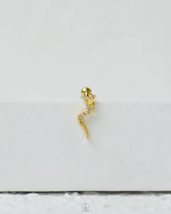 gold strus snake piercing