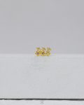 gold strus piercing