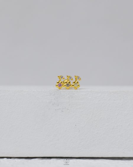 gold strus piercing