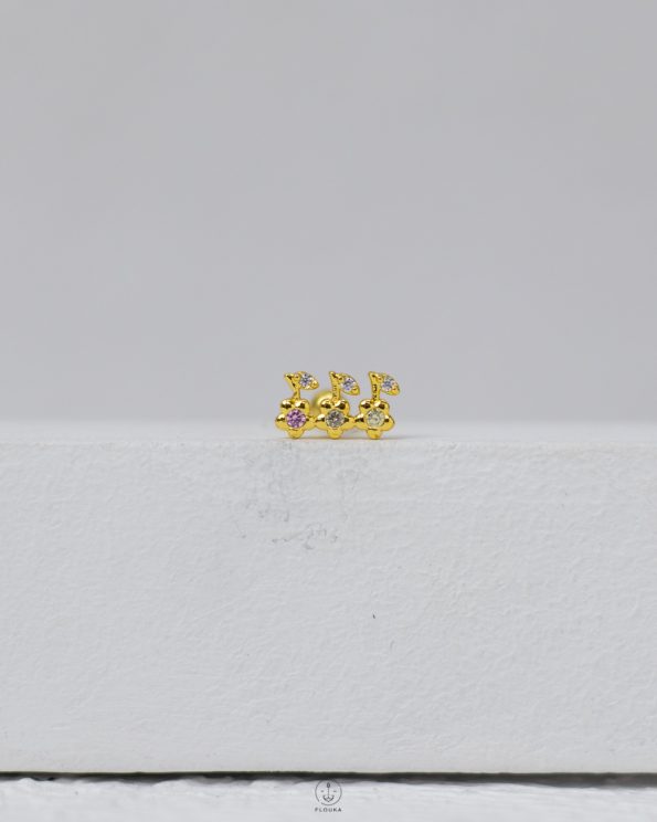 gold strus piercing