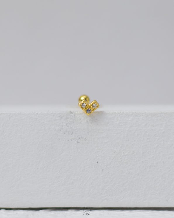 gold strus heart piercing