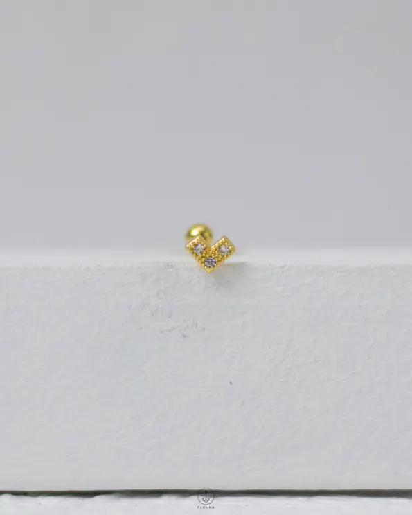 gold strus heart piercing