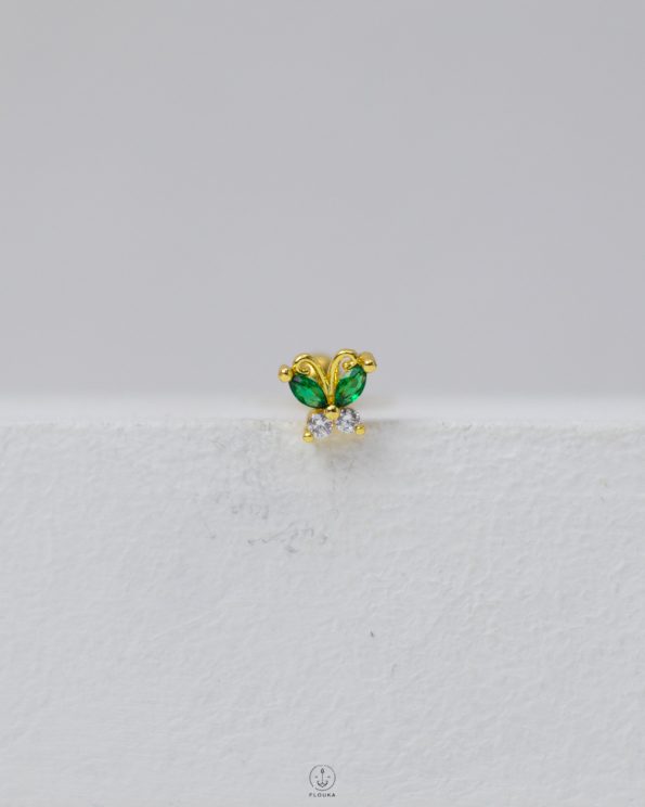 green butterfly piercing