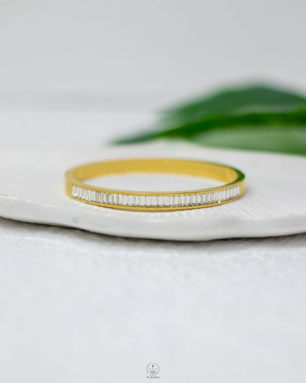 white straus gold bracelet