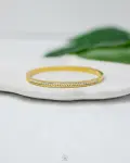 white straus gold bracelet