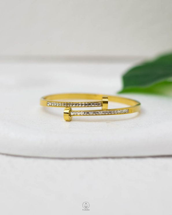 white straus nail gold bracelet