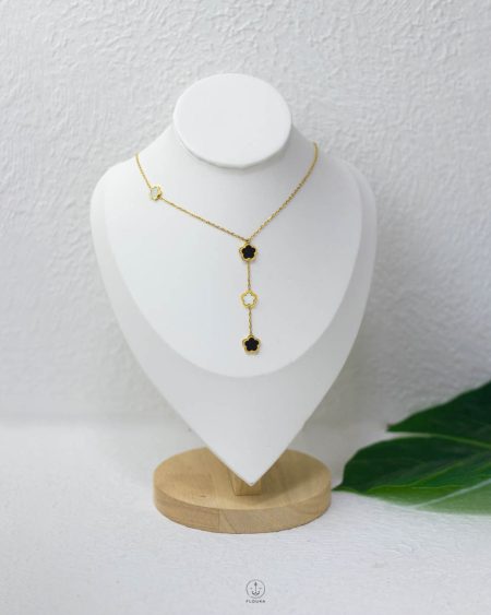 gold necklace black and white flower
