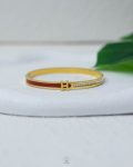 litter H white struas gold and red bracelet