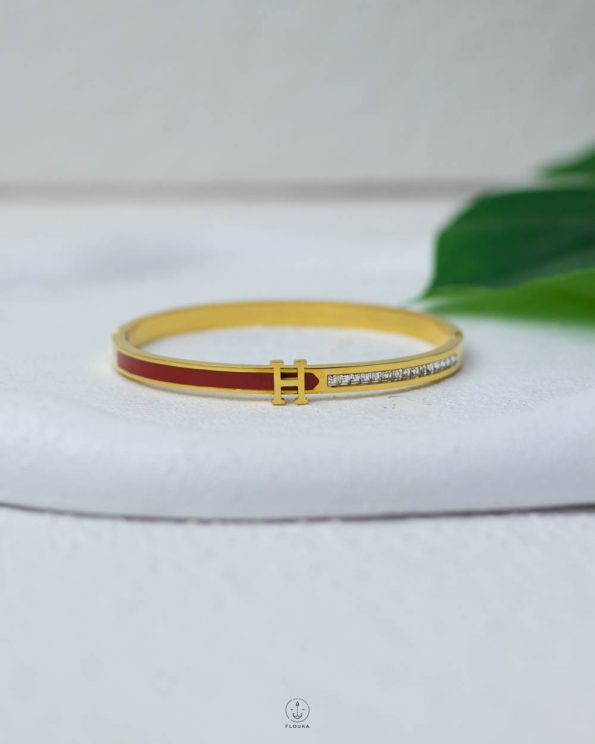 litter H white struas gold and red bracelet